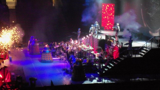 Pyrotechnics fly as the Daleks and the Cybermen make war on each other in Doctor Who Live! (c) BBC Studios The Monsters are Coming New Dalek Paradigm